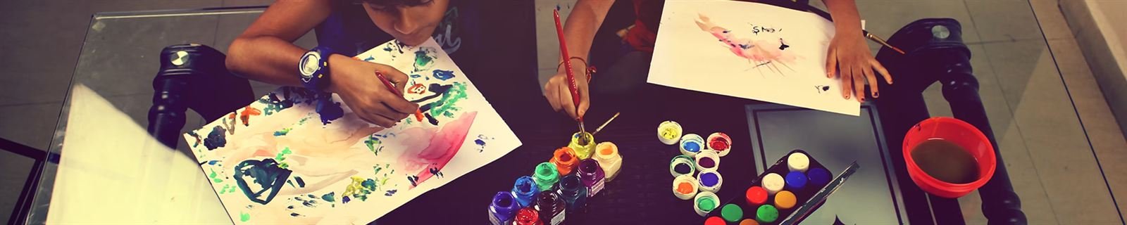 Students painting together in an art class